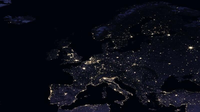 Satellite image of Europe at night with artificial lights spread across the land mass. © NASA. 