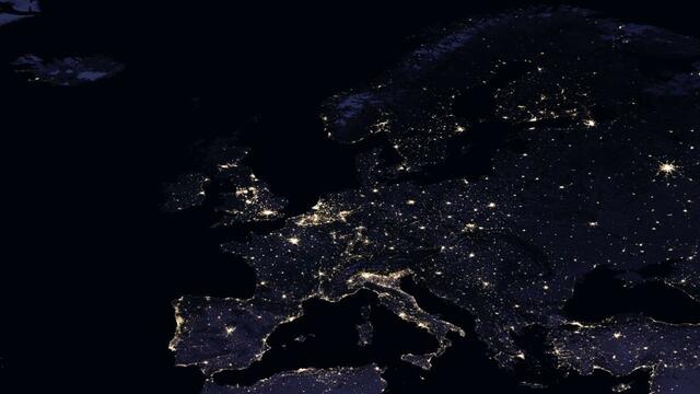 Satellite image of Europe at night with artificial lights spread across the land mass. © NASA. 